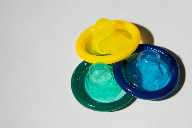 istock Colorful condoms on a light background. 1422283109
