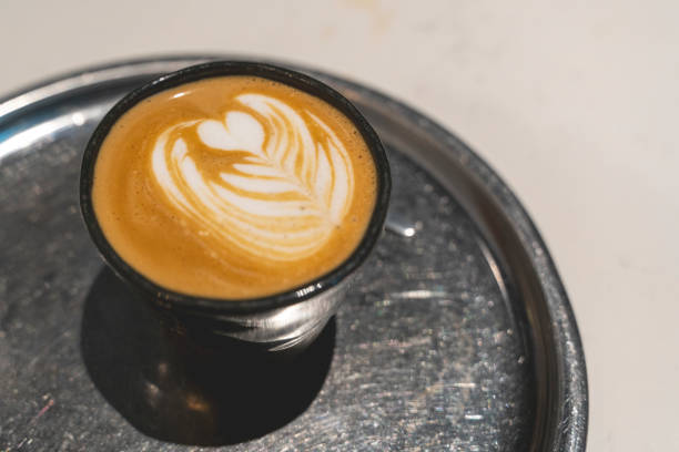 istock Barista serving cup of latte coffee 1422285341