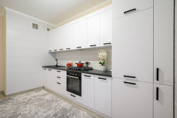 istock Trendy white modern kitchen interior with minimalistic furniture 1422287076