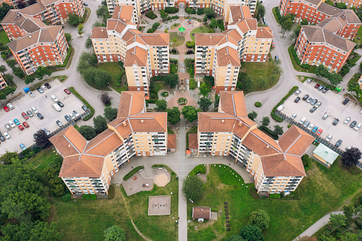 A residential area with apartment buildings, parking lots, parks and playgrounds. Järfälla, Sweden.