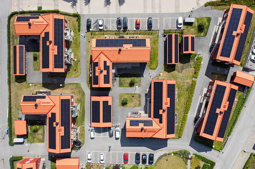 A modern residential area with solar panels on the roof of the apartment buildings. Bålsta, Sweden