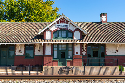 Marseilles, Illinois - United States - August 31st, 2022: The historic Chicago, Rock Island and Pacific Depot, built in 1917, on a sunny Summer morning.