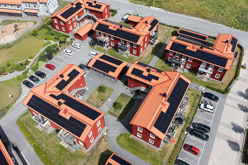 A modern residential area with solar panels on the roof of the apartment buildings. Bålsta, Sweden