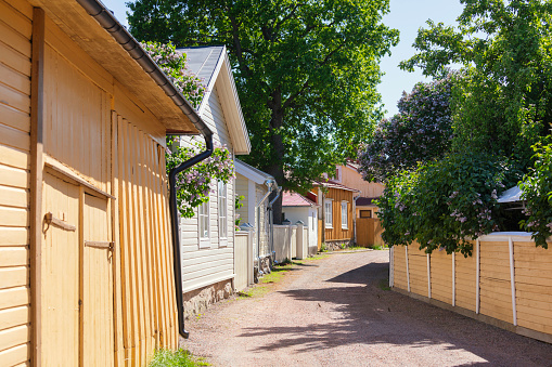 An old street with wooden houses in the coastal town of Tammisaari / Ekenäs in the Raseborg municipality, Finland.