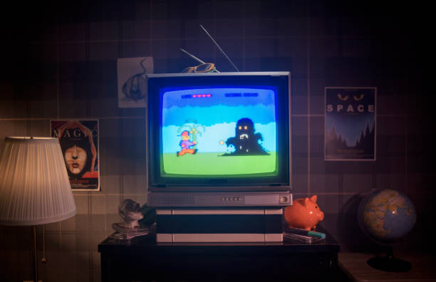 画面上の1980年代のレトロなプラットフォームのビデオゲーム - retro revival video game joystick gamer ストックフォトと画像