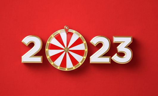 2023 wheel of fortune on red background. Horizontal composition with copy space. Directly above.