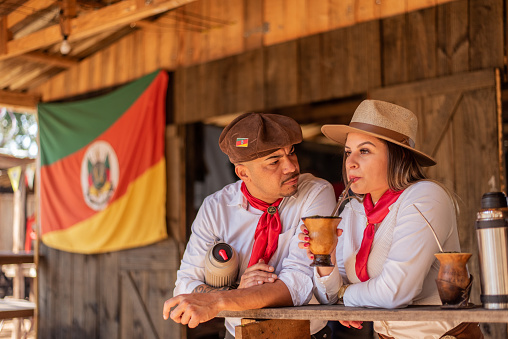 Gaucho couple drinking chimarrao at the farroupilha camp