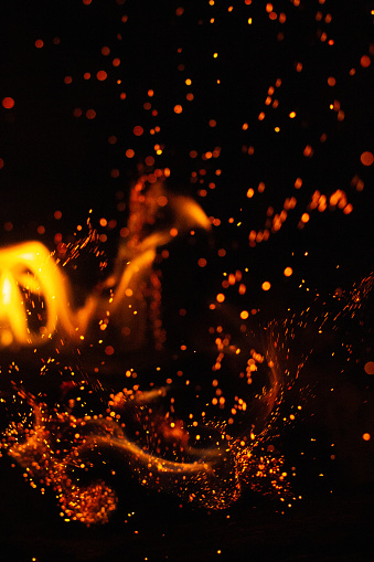 Sparks exploding from the fire