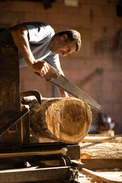istock Man carpenter works at his own business 1422315356
