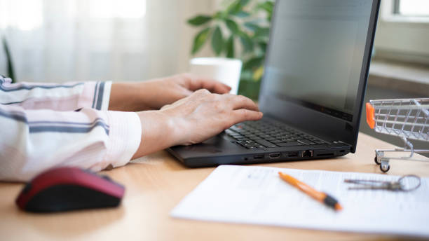 istock Real Estate Agent woman preparing contract on keyboard 1422315849