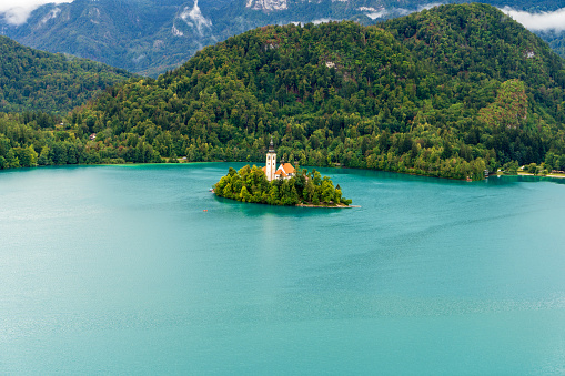 Picture of Church of the Mother of God on an island in turquoise Bled lake, Slovenia.