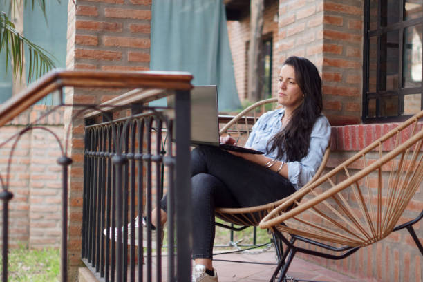 istock woman looking at her laptop 1422322496