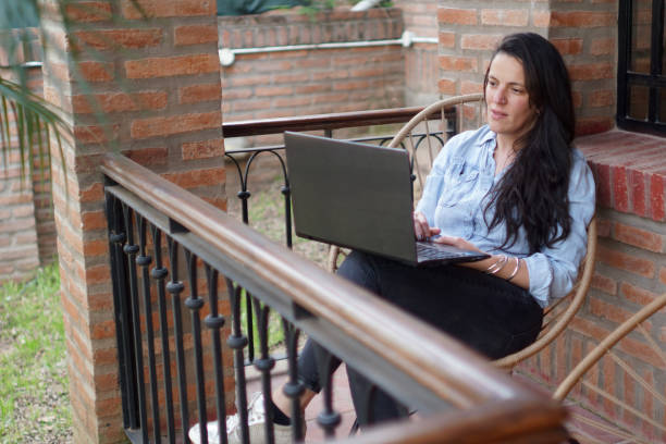 istock woman looking at her laptop 1422322576