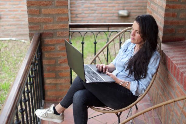 istock woman looking at her laptop 1422322582