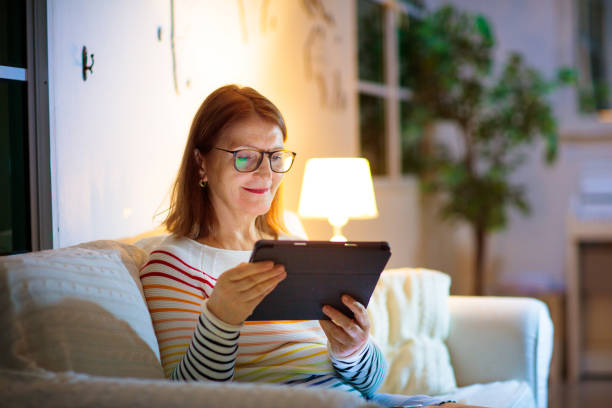 istock Woman with smart phone at home. 1422324037