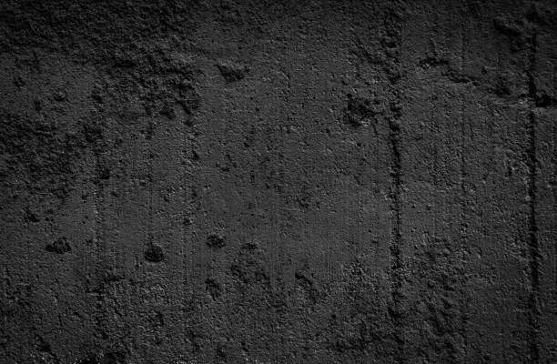 istock Dark grey black textured background. Black grunge cement wall texture for interior design. 1422324408