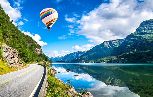 Travel concept. Amazing nature view with fjord and mountains. Beautiful reflection. Location: Scandinavian Mountains, Norway. Artistic picture. Beauty world. The feeling of complete freedom.