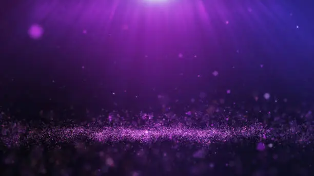 Photo of Glitter purple particles stage and light shine abstract background. Flickering particles with bokeh effect.