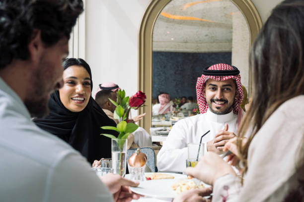 istock Relaxed Middle Eastern friends lunching together 1422327441