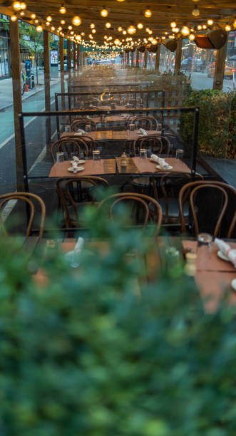 istock Sidewalk cafe in Manhattan, illuminated in the evening. 1422328755