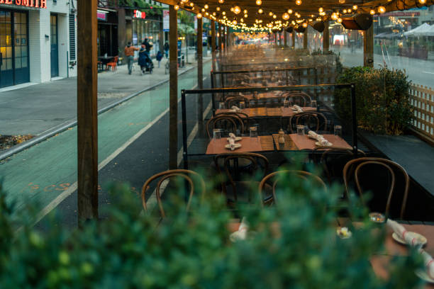istock Sidewalk cafe in Manhattan, illuminated in the evening. 1422328763