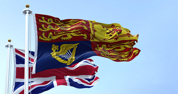 London, UK, September 2022: The Royal Standard of the United Kingdom waving the wind along with the UK flag