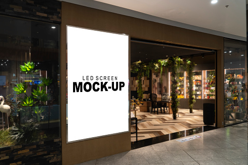 Mockup advertising LED Screen Install at front of restaurant or shop with clipping path, empty space for insert your text, announcement, multi-media content and advertisement in shopping mall
