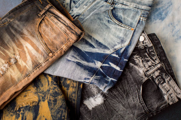 istock Different color and different type of jeans on the table 1422340951