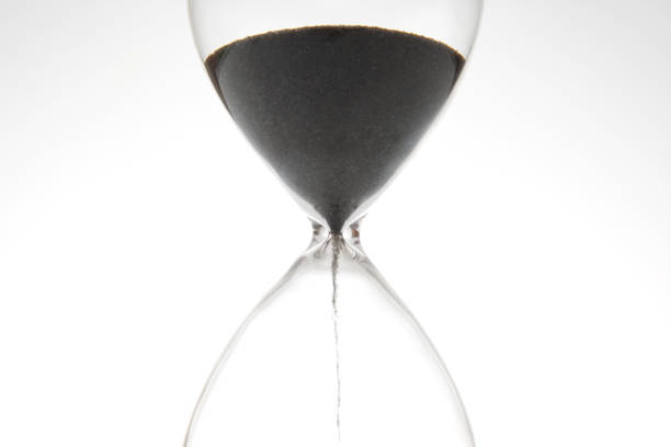 istock Hourglass on a light background. Time is money. Business solutions in time. 1422345053