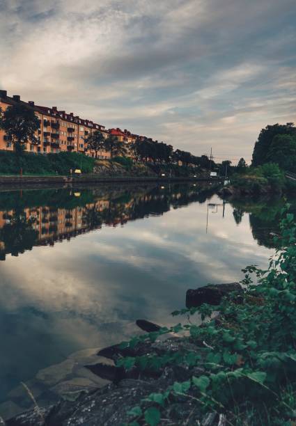 istock Reflections in river in city 1422348467