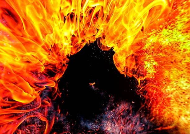 istock 3D illustration of swirling fire on black background 1422348602