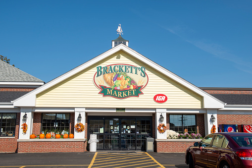 Bath, USA - October 8, 2021. Entrance of Brackett's Market in downtown Bath, Maine, USA