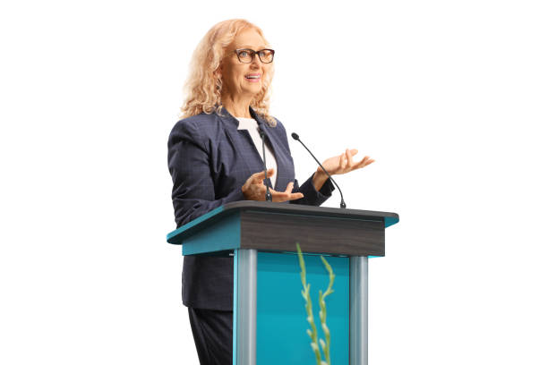 istock Professional woman giving a speech on a stand 1422359272