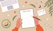 istock Woman write christmas letter to Santa Claus. Winter holiday wish list. Female hands with notebook sheet page. Top view workplace. Cozy vector illustration in flat cartoon style 1422359454