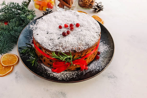 istock Homemade Christmas fruit cake decorated with red ribbon 1422361859