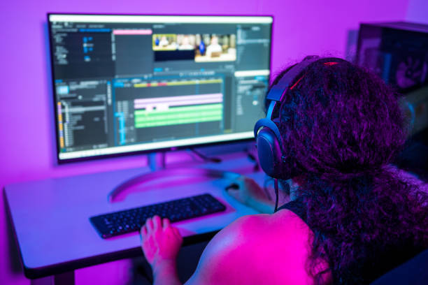 istock Video editors editing a commercial. Person working from home at night. 1422361964