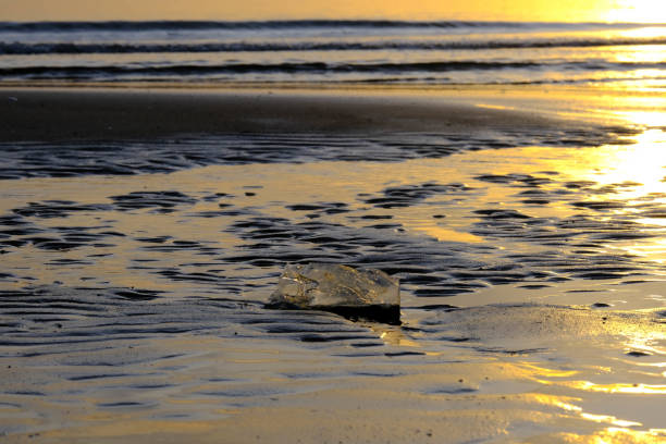 Sunset on the beach.crashing waves