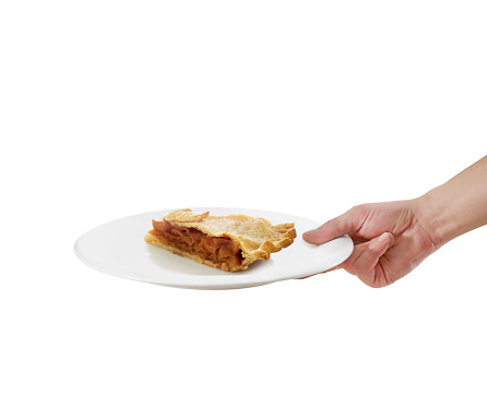 Waiter serving apple pie in a plate