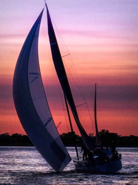 A sailboat on Lake St. Clair which is bordered by Windsor, Ontario and Detroit Michigan