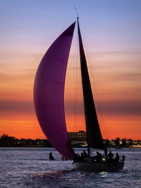 A sailboat on Lake St. Clair which is bordered by Windsor, Ontario and Detroit Michigan