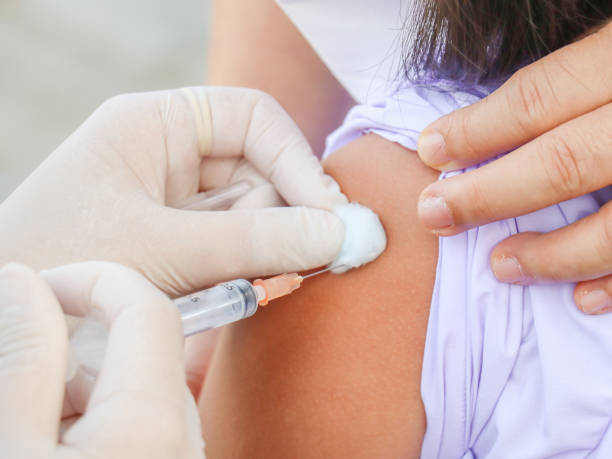 istock children's coronavirus vaccine sit vaccinated with syringe against covid-19. 1422392984