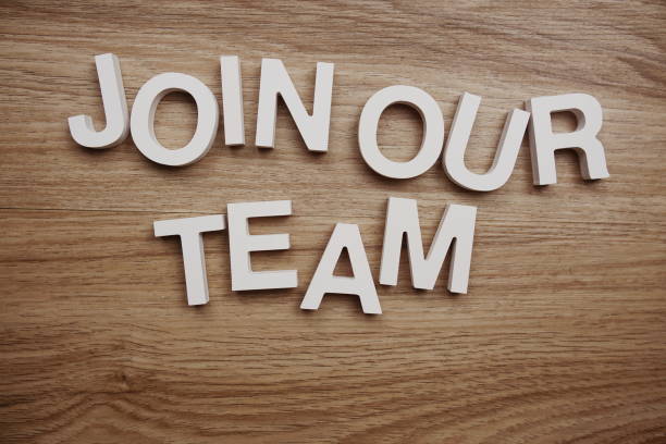 istock Join Our Team alphabet letters on wooden background 1422417932