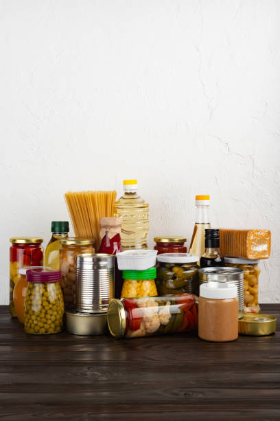 istock Emergency survival food set on dark wooden kitchen table 1422421565
