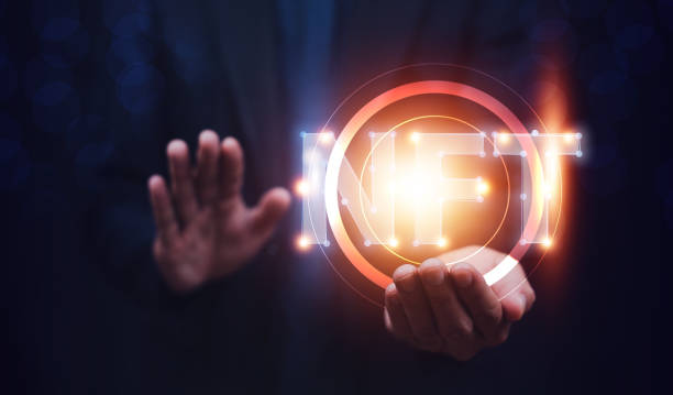 istock Businessman with smartphone holding digital unique art NFT hologram on circuit board binary background, NFT non fungible tokens concept. 1422422101