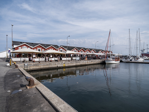 The famous fish warehouses were built in 1907, designed by the Danish architect Thorvald Bindesbøll. Today the majority are converted into restaurants.