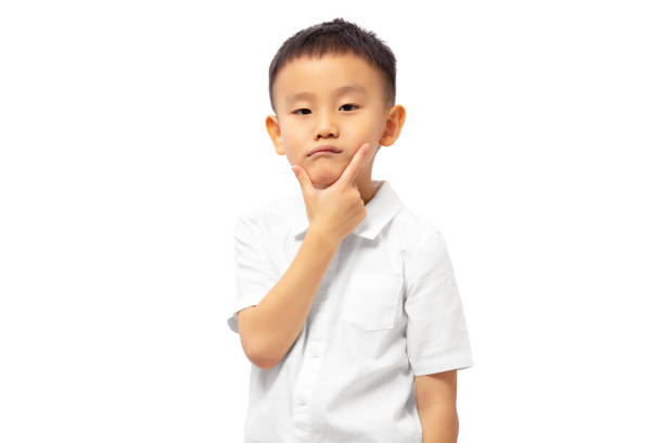 istock Kid thinking with worry and hand on chin 1422429883