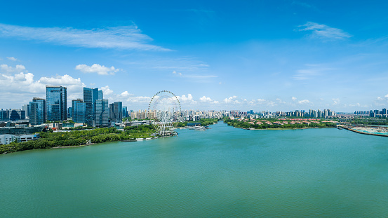 Aerial view of city skyline and modern building with lake natural scenery in Suzhou, China.