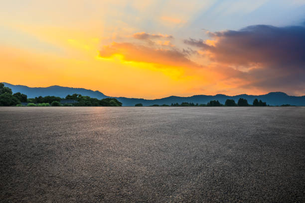 istock Asphalt road and sky clouds at sunrise 1422430135
