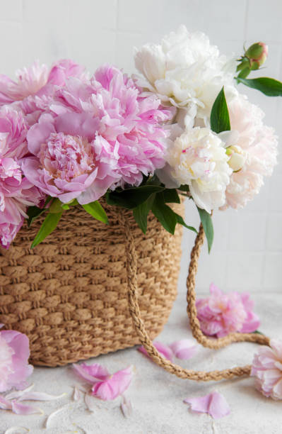 istock Wicker bag with peony flowers 1422439649