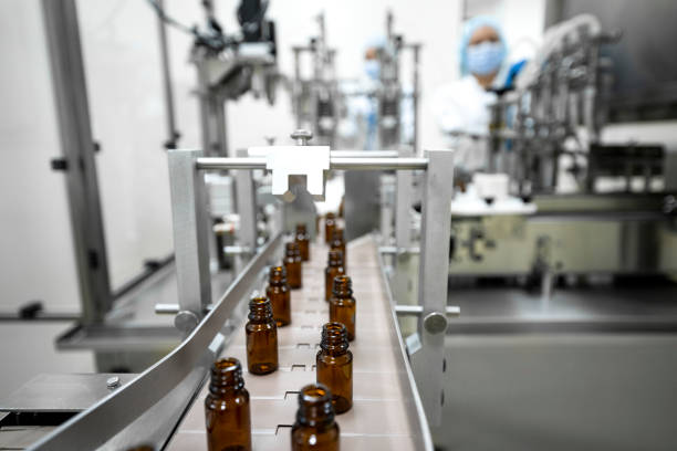 istock Pharmaceutical bottles seen arranged properly during the manufacturing in a pharmaceutical industry 1422443059